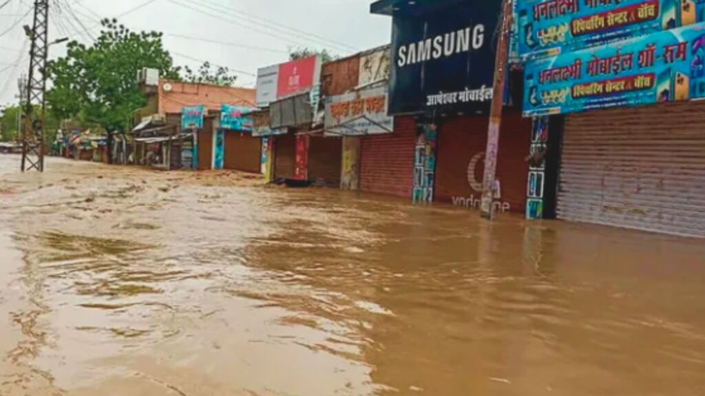 Cyclone biparjoy in Rajasthan watering on road in desert area or Rajasthan.