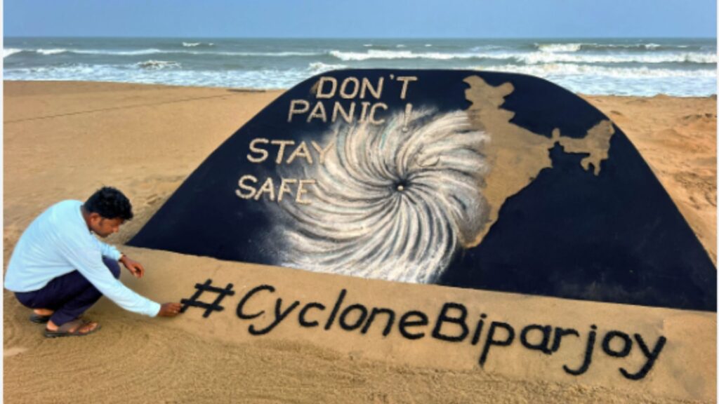 Cyclone biparjoy in Gujarat, An artist make an art on the edge of beach of Gujarat..